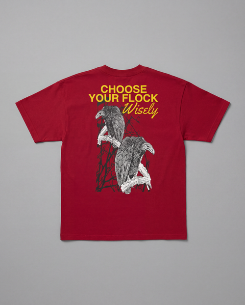 Flat lay back view of the maroon Choose Your Flock Heavyweight Graphic Tee on a neutral gray background, displaying a raised HD graphic of a vulture bird design and text.