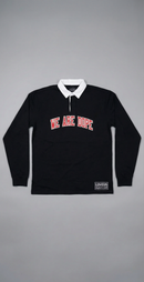 A long-sleeve black We Are Dope Heavyweight Rugby Polo displayed against a clean gray background, showcasing the premium cotton texture and cursive tackle twill design.